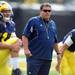 Michigan head coach Brady Hoke keeps an eye on practice during warm ups on Tuesday.  Melanie Maxwell I AnnArbor.com
